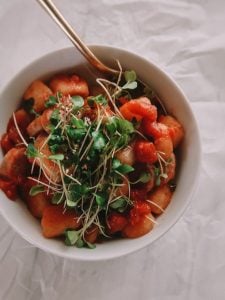 Cauliflower Gnocchi With Sausage and Red Sauce