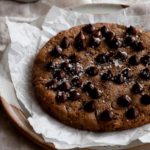 a picture of a very large chocolate chip cookie
