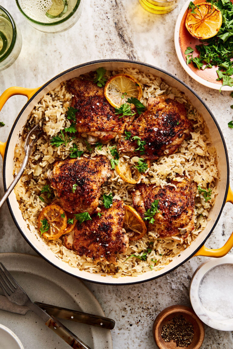 A big pot of the one pan greek chicken and lemon rice, sitting on a countertop