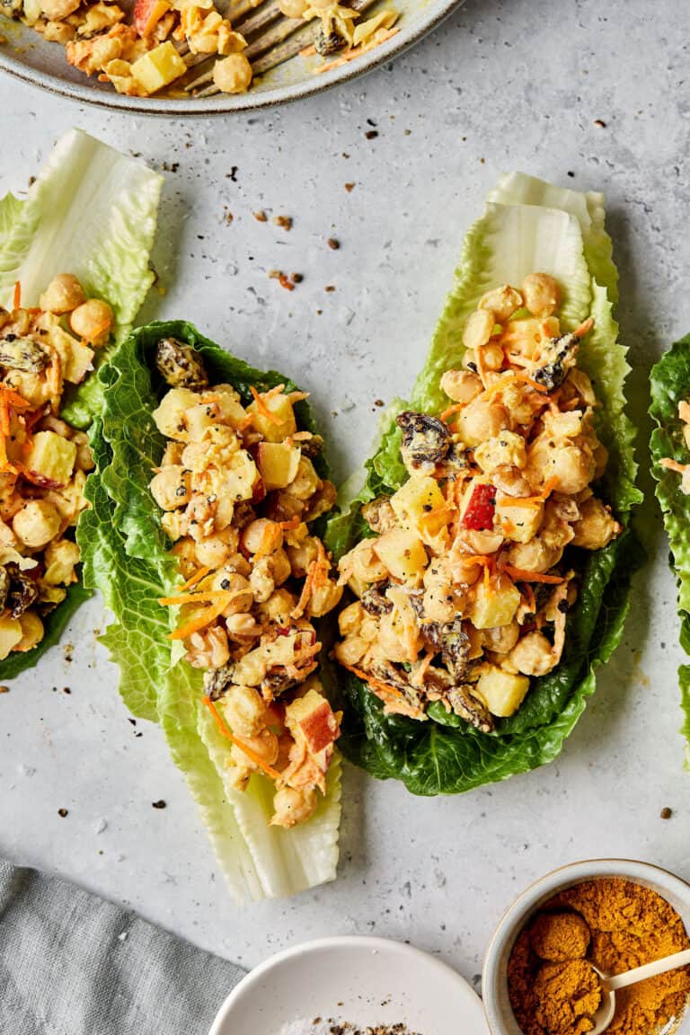 Three romaine lettuce leaves stuffed with the smashed chickpea curry salad