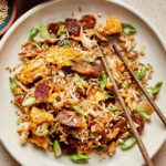 A bowl of the healthy fried rice, with a pair of chopsticks sticking out of it