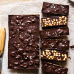 A batch of the homemade healthy crunch bars, laid out on a sheet of parchment paper.