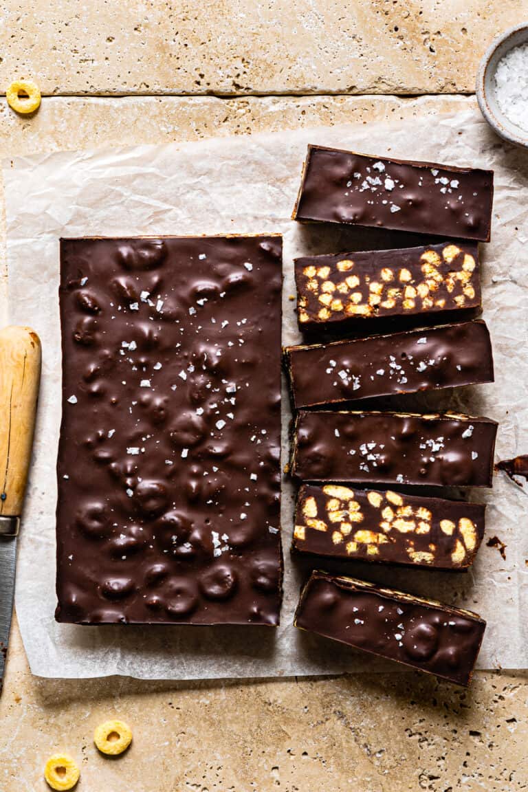 A batch of the homemade healthy crunch bars, laid out on a sheet of parchment paper.