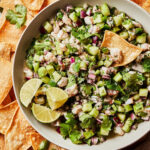 A bowl of the ultimate shrimp ceviche, along with a side of homemade tortilla chips