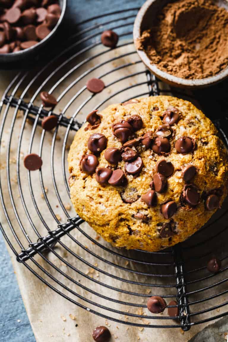 A cooling rack, sitting on a counter, with the single serving scone on top
