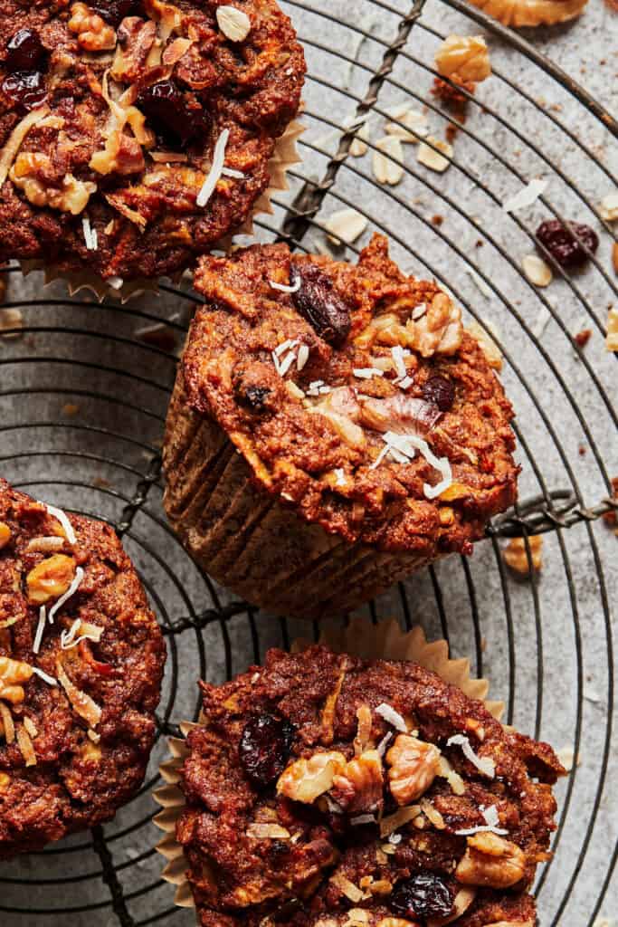 A wire cooling rack, topped with the gut healthy pumpkin morning glory muffins