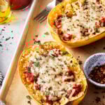 Two of the spaghetti squash pizza boats, on a baking sheet
