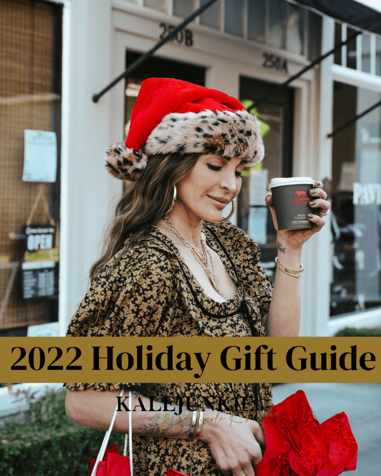An image of Nicole K. Modic, founder of Kalejunkie, wearing a Santa hat. The text "2022 Holiday Gift Guide" is written over the image