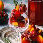 A tall glass, filled to the brim with the holiday pomegranate ice cubes