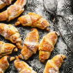 A bunch of the mini Nutella croissants, laid out on a countertop