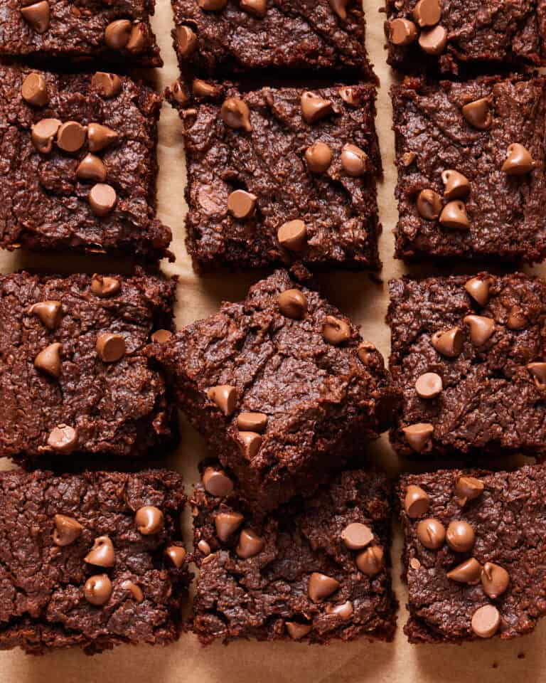 A close-up image of the healthy chickpea brownies, cut into squares, with the focus on one of the squares