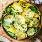 A bowl of the 5-minute summer squash salad, sitting on a countertop