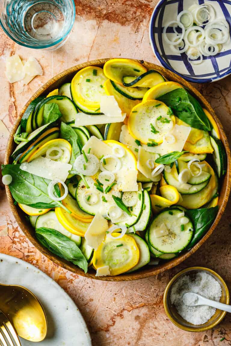 A bowl of the 5-minute summer squash salad, sitting on a countertop