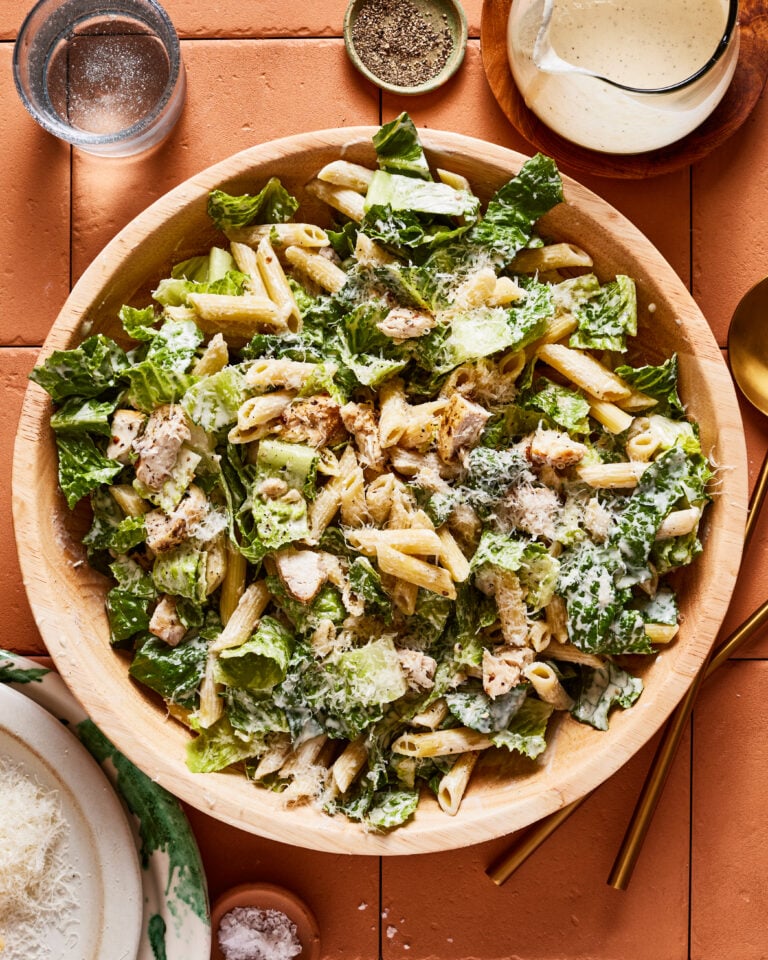 A bowl of the chicken caesar pasta salad, sitting on a countertop