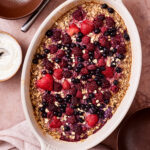 A pan of the mixed berry protein oatmeal, sitting on a countertop