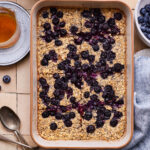 A pan full of the lemon blueberry baked oatmeal, cut into slices