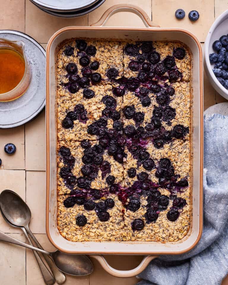 A pan full of the lemon blueberry baked oatmeal, cut into slices