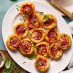 A plate of the crunchy pizza potato cups, sitting on a countertop