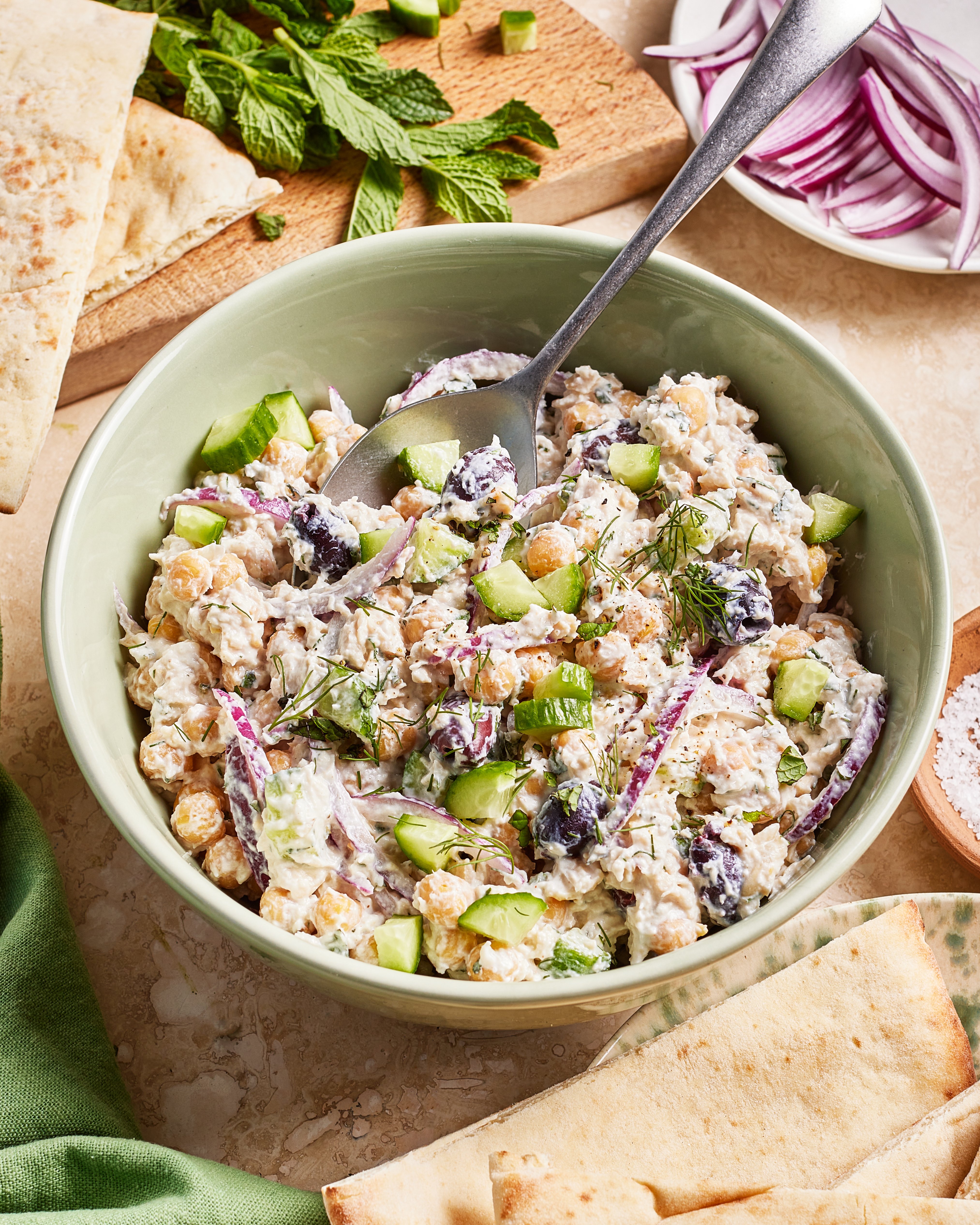 A bowl of food with a spoon.