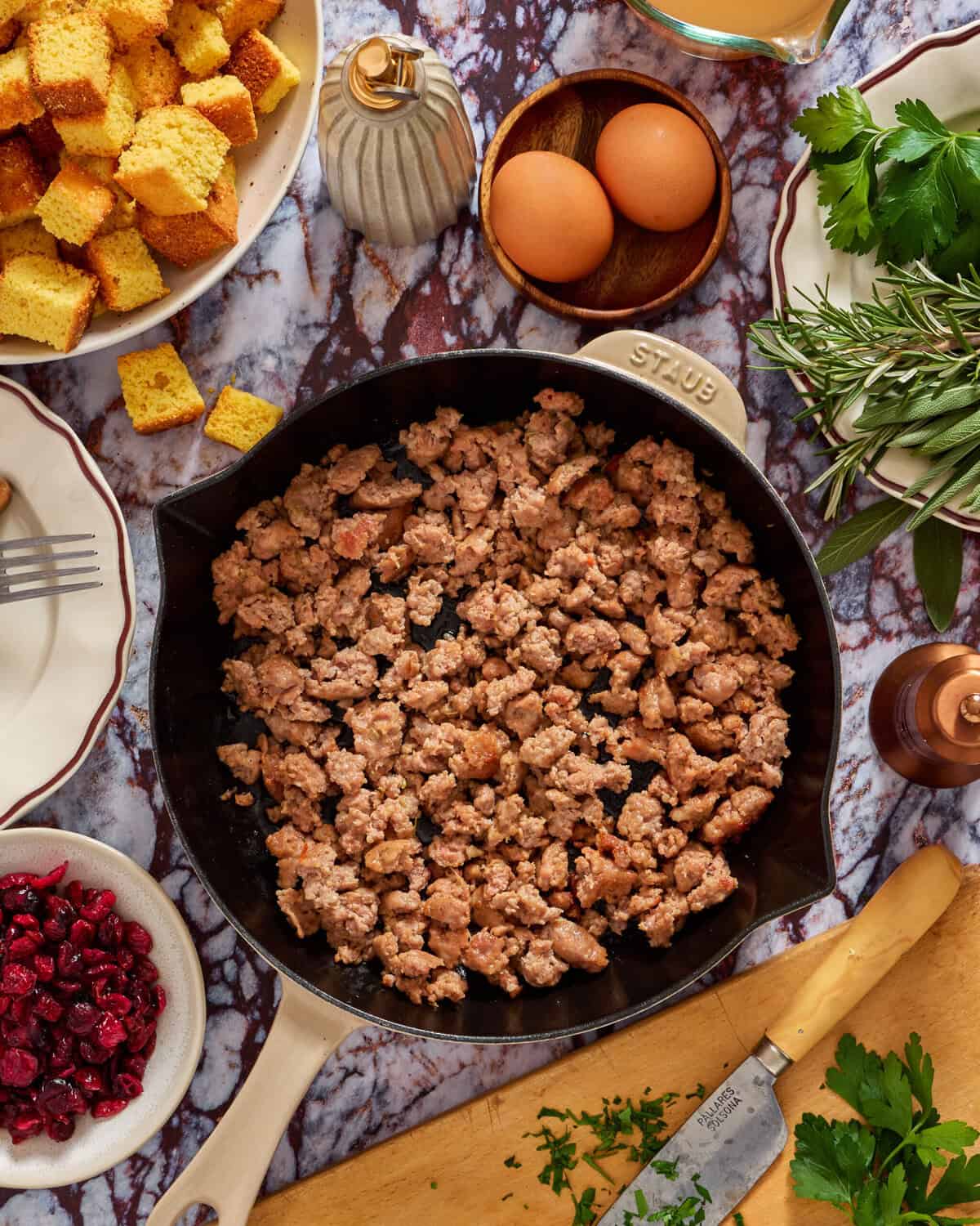 A pan of food on a marble table.