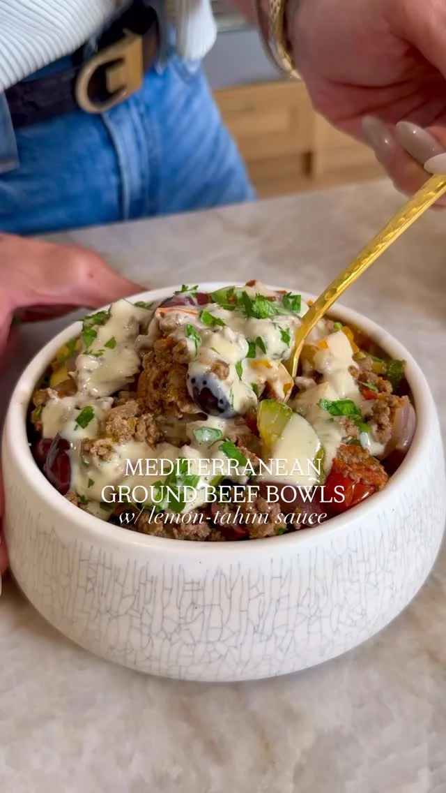@kalejunkie ✨ MEDITERRANEAN GROUND BEEF BOWLS W/ LEMON TAHINI SAUCE, another banger of a recipe right here for you! I’m Nicole—your go-to gal for easy, nourishing recipes that the whole family will love—this one is the perfect addition to your weeknight rotation and it’s indulgent enough for a date night at home. You get delicious Mediterranean vibes in every bite—juicy ground beef, fresh veggies, briny olives, and my signature creamy lemon-tahini sauce that ties it all together for a perfectly well balanced meal. Serve on its own or over rice.⁣
⁣
Comment LINKS and I will DM you the links for all of the items I’m using in this reel—my fav portable blender, cutting board, and more :)⁣
⁣
Makes 4 servings⁣
3 cloves garlic, mashed⁣
1 zucchini, chopped (~3/4 cup)⁣
1 orange bell pepper, chopped⁣
3/4 cup cherry tomatoes, halved⁣
¼ cup kalamata olives, sliced⁣
1 tb olive oil⁣
1/2 red onion, diced⁣
1 lb ground beef⁣
2 tsp dried oregano⁣
1 tsp cumin⁣
1 tsp paprika⁣
1 tsp kosher salt⁣
1/2 tsp ground black pepper⁣
1/2 cup feta cheese, crumbled⁣
2 tb parley, chopped⁣
⁣
Lemon Tahini Sauce:⁣
¼ cup lemon juice⁣
⅓ cup olive oil⁣
3 tb tahini⁣
2 tb honey⁣
2 tb red wine vinegar⁣
1 clove garlic, mashed⁣
1 tsp sea salt⁣
1 tsp black pepper⁣
Water to thin, as needed⁣
⁣
Prepare sauce—add all of the sauce ingredients to a small blender and blend until creamy and smooth. Taste and add water to thin as needed, then set aside. Mash your garlic and chop veggies—zucchini, bell pepper, tomatoes, olives, and red onion. Add olive oil to a large pan over medium heat. Once the pan is hot, add the red onion and saute for 3 minutes or so, then add the garlic. Stir for about 15 seconds, then add in the ground beef, breaking it down into tiny pieces and stirring until cooked through. Next add the bell pepper, zucchini, tomatoes and seasonings (oregano, cumin, paprika, salt and pepper). Continue to stir for another 5 minutes or so until all of the veggies have softened. Stir in the olives and feta cheese. Remove from the heat and divide between bowls and drizzle the lemon tahini sauce on top. ENJOY!⁣