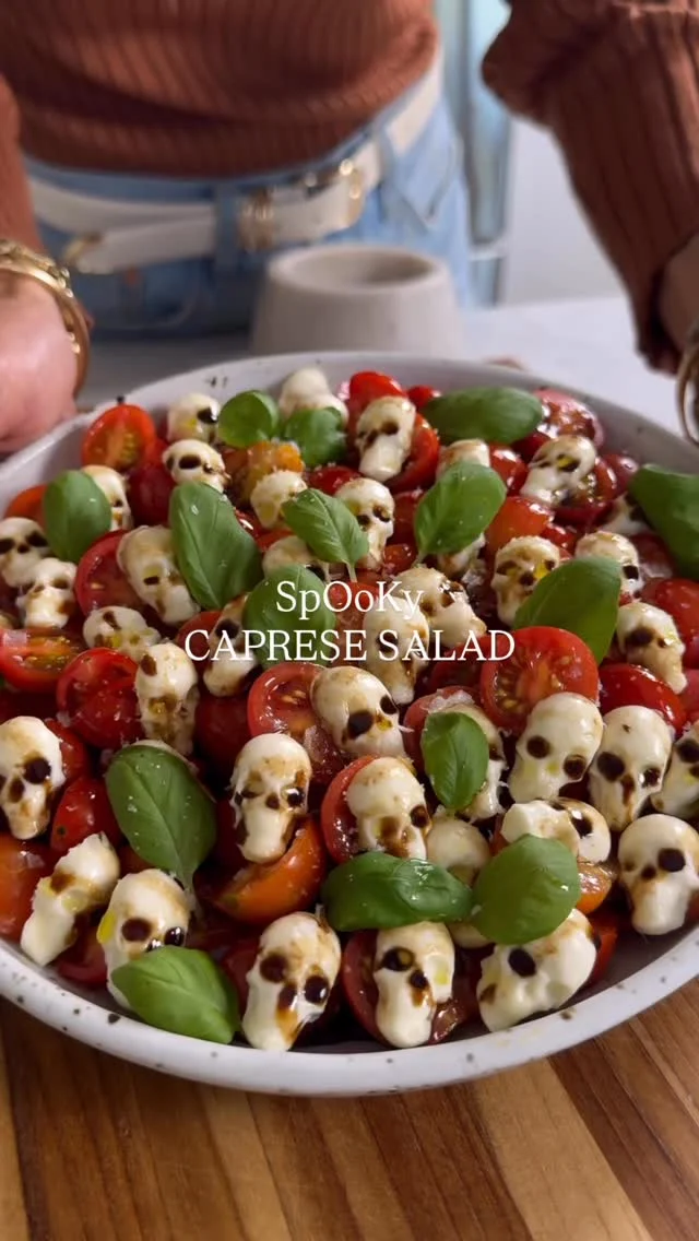 @kalejunkie SPOOKY CAPRESE SALAD, a fun, low effort idea for Halloween! All you need are these cute little silicone skull molds and mozzarella cheese and
you can make this too!

Comment ‘LINK’ and I will send you the link to my skull trays! 

What you need:
Cherry tomatoes, halved
Pearl mozzarella balls
Basil
Olive oil
Balsamic vinegar
Flaky salt

Preheat oven to 350F. Break apart mini mozzarella balls and press into the trays. Bake for 4 minutes.
Remove from oven and pat down any liquid, continuing to press the cheese into the mold. Transfer the tray to the refrigerator for 5-10 minutes. Remove skulls from the tray and build your salad. Add halved tomatoes to a plate, the skeleton cheese, and basil. Drizzle with olive oil, balsamic vinegar and top with flaky salt. Enjoy!