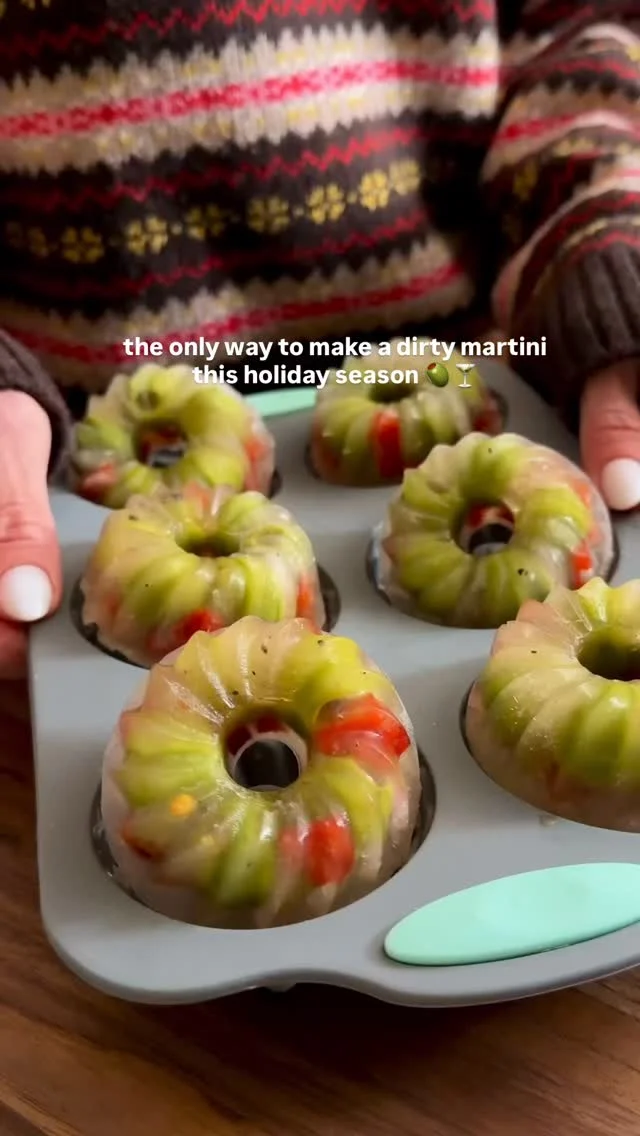 @kalejunkie 🫒🍸comment LINK so you can make these DIRTY MARTINI WREATH ICE CUBES! These are perfect to add to your holiday dirty martinis—your drinks stay dirty and won’t get watered down. I also love the roasted red peppers but you can use pimento stuffed olives if you prefer! Don’t forget to FOLLOW @kalejunkie for more fun ideas + recipes! 🫶🏻

1 9oz jar pitted castelvetrano olives (+ the juice)
1/2 cup roasted red peppers in a jar, chopped

Add olives to small donut molds. Chop the red peppers into small pieces and add them in between the olives. Pour the olive juice from the jar on top and freeze overnight. I added to martini glasses and topped with a martini!

The perfect dirty martini (for 2)
6oz vodka 
tiny splash vermouth 
Splash olive juice

To make a martini, add lots of ice, vodka, vermouth, and olive juice to a cocktail shaker. Shake vigorously. Transfer to a cold martini glass, add a dirty martini ice cube wreath and enjoy!
#holidayentertaining #icecubes #dirtymartini #martini #holidaymartini