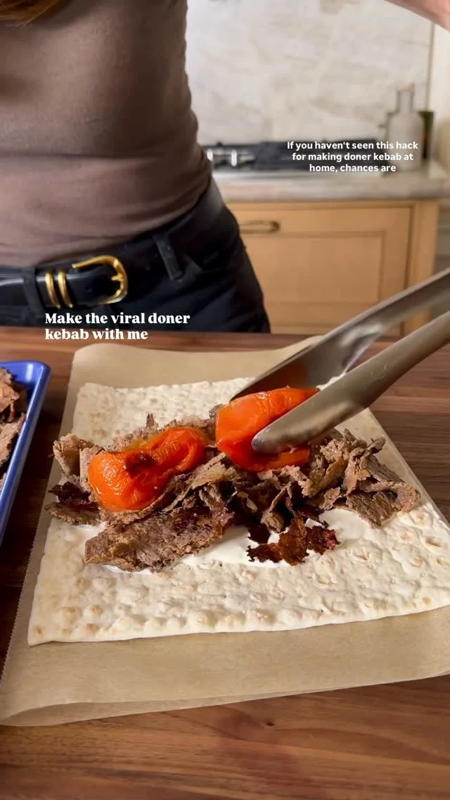 @kalejunkie I can confirm that the VIRAL DONER KEBAB HACK is the easiest way to make doner kebab at home, no spit needed! Pressing the meat thin between two pieces of parchment paper, rolling it up, and baking is genius. I served mine with piyaz (onion salad I grew up with) and my yogurt tahini sauce. Thanks to @mezemike for the original inspo! 🫶🏻⁣
⁣
Comment LINKS for the tools I used in this video to make it!⁣
⁣
Makes 4 servings⁣
Doner⁣
2 lbs ground beef (90/10 for lean)⁣
1 small yellow onion, grated⁣
3 cloves garlic⁣
1 tb paprika⁣
1 tb garlic powder⁣
2 tsp cumin⁣
2 tb dried parsley⁣
1/2 tsp coriander⁣
3 tsp sumac⁣
1 tsp kosher salt & 1 tsp black pepper⁣
3 tb greek yogurt⁣
2 tb tomato paste
3 tb olive oil⁣
⁣
Yogurt tahini sauce⁣
1 cup greek yogurt ⁣
3 tb tahini⁣
1 lemon, juiced ⁣
2 cloves garlic, mashed⁣
1 tsp cumin⁣
1 tsp kosher salt & 1/2 tsp black pepper⁣
⁣
Piyaz salad⁣
1 red onion, finely sliced⁣
2 tb sumac⁣
1/2 lemon⁣
2 tb olive oil⁣
2 tb parsley, chopped⁣
⁣
4 pieces lavash⁣
Roasted veggies (tomatoes, bell pepper, jalapeno)⁣
Romaine lettuce⁣
⁣
Preheat oven to 400F. Add onion and garlic to a small food processor and pulse until it’s almost a paste. Transfer to a large bowl along with the beef, seasonings, yogurt, tomato paste and olive oil. Mix very well. Take a small handful of meat (~3/4 cup) and place between two pieces of parchment paper. Roll it out thin and as evenly as possible. Roll it up and repeat with the rest of the meat. Bake for 30 minutes. Remove from oven, unroll and break up the meat. ⁣
⁣
It making the piyaz: thinly slice red onion using a mandolin. Add to a bowl along with the seasonings. Toss well.⁣
⁣
If making the sauce: add all ingredients to a bowl and whisk together well. Taste and adjust seasonings and add water as needed to thin.⁣

#viralrecipes #doner #foodtrends #donerkebab