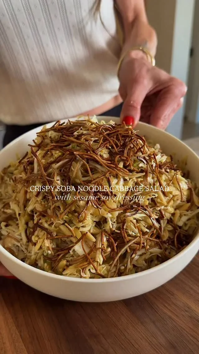 @kalejunkie CRISPY SOBA NOODLE SESAME CABBAGE SALAD and OMGAHHHHHH please do yourself a favor and go make this fantastic salad! The flavors get better and better as the dressing softens the cabbage and that crispy soba on top is chef’s kiss 🤌🏼🤌🏼 (Get ready for more crispy soba salads!)⁣
⁣
FOLLOW @kalejunkie and SHARE this post with friends! That’s the best way you can support my work ☺️!⁣
⁣
1 small green or purple cabbage (~5 cups)⁣
2 bunches green onions, sliced⁣
1/2 cup slivered almonds⁣
⁣
1 cup cooked soba noodles (1 bundle)⁣
1 tsp sesame oil ⁣
1 tb low sodium soy sauce⁣
⁣
Dressing⁣
3 tb sesame oil⁣
3 tb avocado oil⁣
1/3 cup rice vinegar ⁣
1/3 cup low sodium soy sauce⁣
3 tb honey (or maple syrup)⁣
1/4 cup sesame seeds⁣
1/2 tsp ground black pepper⁣
⁣
Preheat oven to 375F. Bring a pot of water to a boil. Once the water is boiling, break the soba noodles into small pieces and add to the water. After four minutes or once the noodles have cooked, drain, removing as much water as possible. Transfer to a parchment lined baking sheet and coat well with the sesame oil and soy sauce. Bake for 15 to 16 minutes, tossing at the halfway point to ensure that everything browns evenly and gets crispy. Remove from the oven. Next, make the dressing. Add all of the dressing ingredients to a bowl and whisk together well. Taste and adjust as needed. Finally, shred cabbage very thin with a mandolin and add to a large bowl along with the sliced onions, slivered almonds and crispy soba. Pour the dressing on top, toss to coat very well and enjoy!⁣
⁣
salad recipe | crispy soba | crispy rice | 10 minute recipes | cabbage salad ⁣