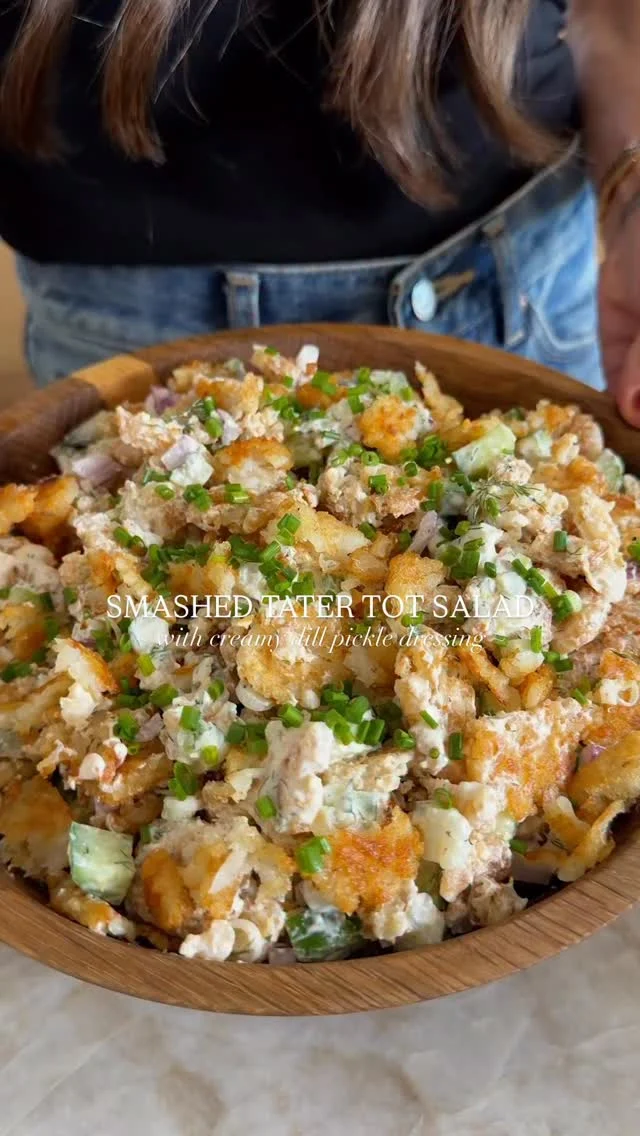@kalejunkie SMASHED TATER TOT SALAD WITH DILL PICKLE YOGURT DRESSING, the perfect FUN dish to make for the Super Bowl! Tater tots will always be one of my favorite comfort foods, so I thought what better than to smash them and get them crispy and turn them into a salad?! The dressing is a creamy and tangy dill pickle dressing (no mayo), which goes so well with the tater tots and everything else in the salad. I intended to add bacon, but forgot lol. This recipe is easy to make and packed with flavor.⁣
⁣
SAVE this post, SHARE with friends and FOLLOW me @kalejunkie for more easy, fun recipes!⁣
⁣
Makes 8 servings⁣
TATER TOT SALAD⁣
28-32 oz tater tots (this is 2 bags of @cascadianfarms or 2 bags of @rootsfarmfresh or 1 bag of Ore Ida mini tater tots, depending on the brand you want to use)⁣
2 Persian cucumbers, chopped⁣
4 green onions, sliced⁣
3 dill pickles, chopped⁣
1/3 cup red onion, finely diced⁣
4 slices cooked bacon, chopped (optional)⁣
⁣
CREAMY YOGURT DRESSING⁣
1 1/2 cups greek yogurt ⁣
1 lemon zested and juiced⁣
3 tb fresh dill, chopped⁣
1/4 cup dill pickle juice⁣
1 tsp dijon mustard ⁣
1/2 tsp paprika⁣
1 tsp garlic powder⁣
1 tsp onion powder⁣
1 tsp kosher salt⁣
1/2 tsp ground black pepper⁣
⁣
Preheat oven to 425F. Spread tater tots onto a full size baking sheet. Bake for 12 minutes then remove from oven. Smash them with a measuring cup and place them back in the oven for another 15-16 minutes until golden and crunchy. You might need to flip them once and bake for another 2-3 minutes. Remove from oven and set aside. Next, make the creamy yogurt dressing. In a medium bowl or measuring cup, mix together the yogurt, lemon juice, zest, dill, pickle juice, mustard, and seasonings, until smooth. Taste and adjust as needed. Transfer tater tots to a large bowl. Add the cucumbers, green onions, pickles, red onion, and bacon (if using). Pour dressing on top, toss to coat well. This salad is best enjoyed right away while the tater tots are crunchy.