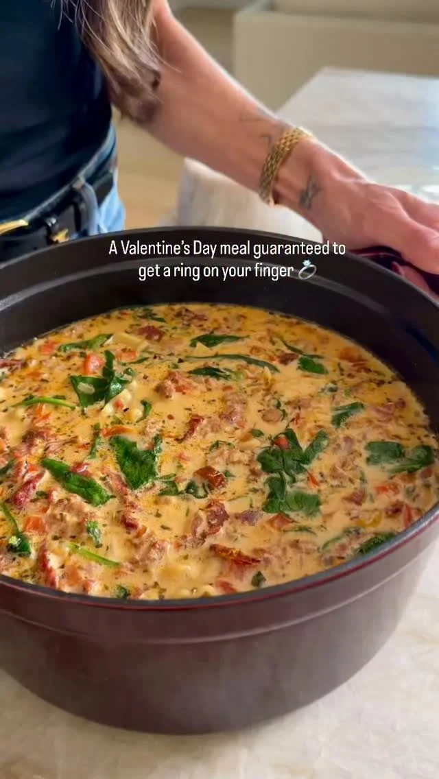 FOLLOW @kalejunkie FOR MORE
MARRY ME ITALIAN SAUSAGE SOUP for Valentine’s Day and anytime that cozy soup craving hits-THIS is a winner
and I can’t wait to see your remakes! You can use any pasta shape you want and because the pasta cooks in the soup, it’s a low effort, easy clean up meal that might just land you a marriage proposal-I guess there’s only one way to find out
Makes 6 servings
1/2 cup sundried tomatoes, in oil
1 Ib mild or spicy Italian sausage
1/2 white onion, finely diced
1 red bell pepper, diced
3 cloves garlic, minced
6 cups chicken broth
2 tsp Italian seasoning
1 tsp crushed red pepper flakes
1 tsp kosher salt
3/4 cup dried pasta of choice (I’m using gluten-free pasta)
3/4 cup heavy cream or coconut milk
3 cups spinach
1/3 cup fresh basil, chopped
3/4 cup parmesan cheese, freshly grated
First, slice the sundried tomatoes into pieces and set aside.
Chop the onion, bell pepper, and mince your onion. Use 2 tb of the oil from the sundried tomato jar and add it to a large pot over medium heat. Once the pot is hot, add the sausage.
Mash into smaller pieces and once almost cooked through, add the onion, pepper, and garlic. Stir for 4-5 minutes until the veggies have softened then add in the chicken broth, sun-dried tomatoes, italian seasoning, red pepper flakes, and salt. Stir and bring to a gentle simmer then add in the pasta and let cook for 4-5 minutes, stirring, then reduce heat to low and add the heavy cream, spinach, and basil, stirring until fully incorporated and the spinach has wilted.
Let cook for 3-4 more minutes or until the pasta is al dente.
Remove from heat and stir in the parmesan cheese. Divide into bowls and serve with more parmesan cheese on top.
Enjoy!