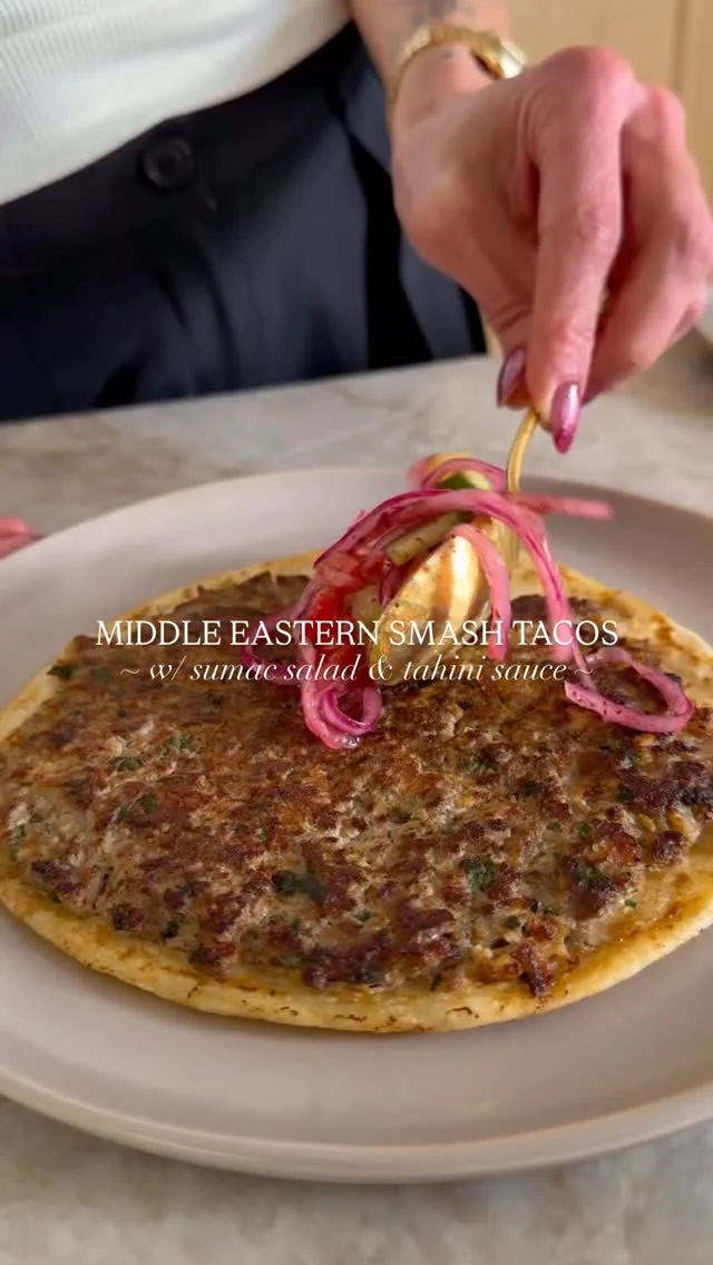@kalejunkie MIDDLE EASTERN SMASH TACOS with tahini sauce and a yummy tangy sumac salad 🌮 I’m just changing things up around here from a regular taco—this has all the vibes of arayes but as a thin taco instead, topped with a tangy salad and tahini sauce. SO SO SO FLAVORFUL and ofc like all my recipes, it’s easy to make! ⁣
⁣
SHARE this post with friends, SAVE, and FOLLOW me @kalejunkie for more easy dinner ideas!⁣
⁣
Tacos⁣
1 lb ground beef (80/20 preferably)⁣
1/2 white onion, grated ⁣
1/2 cup parsley, finely chopped⁣
2 cloves garlic, minced or mashed⁣
1 tsp cumin⁣
1 tsp allspice ⁣
1 tsp paprika ⁣
1 tsp kosher salt⁣
1/2 tsp black pepper⁣
8 taco size flour tortillas⁣
⁣
Sumac salad⁣
2 persian cucumbers, chopped⁣
1/3 cup red onion, thinly sliced⁣
2 roma tomatoes, diced⁣
2 tb red wine vinegar⁣
1 tb sumac⁣
1/2 tsp kosher salt⁣
⁣
Tahini sauce⁣
1/2 cup tahini⁣
2 tb honey⁣
1 clove garlic⁣
1 lemon, juiced⁣
1/2 tsp kosher salt⁣
1/4 cup water⁣
⁣
First make the meat mixture. Add all of the ingredients to a bowl and mix to incorporate well. Set aside. Next make the sumac salad and sauce. For the salad, add the chopped cucumbers, tomatoes and sliced onions to a bowl. Toss with the vinegar, sumac, and salt and set aside. Make the tahini sauce by adding everything to a small blender and blending until smooth. Taste and adjust as needed. Finally, make the smash tacos. Spread ~3-4 tablespoons of the meat mixture into an even layer on each tortilla. Heat a pan over medium heat. Place each tortilla meat side down on the pan and cook for ~4 minutes, pressing it down with a heavy object or a press so the meat doesn’t shrink up and cooks evenly. Flip to the other side and let cook one minute more. Remove from pan and repeat with remaining tortillas. Finally, assemble tacos with the sumac salad on top and lots of tahini sauce. Enjoy!