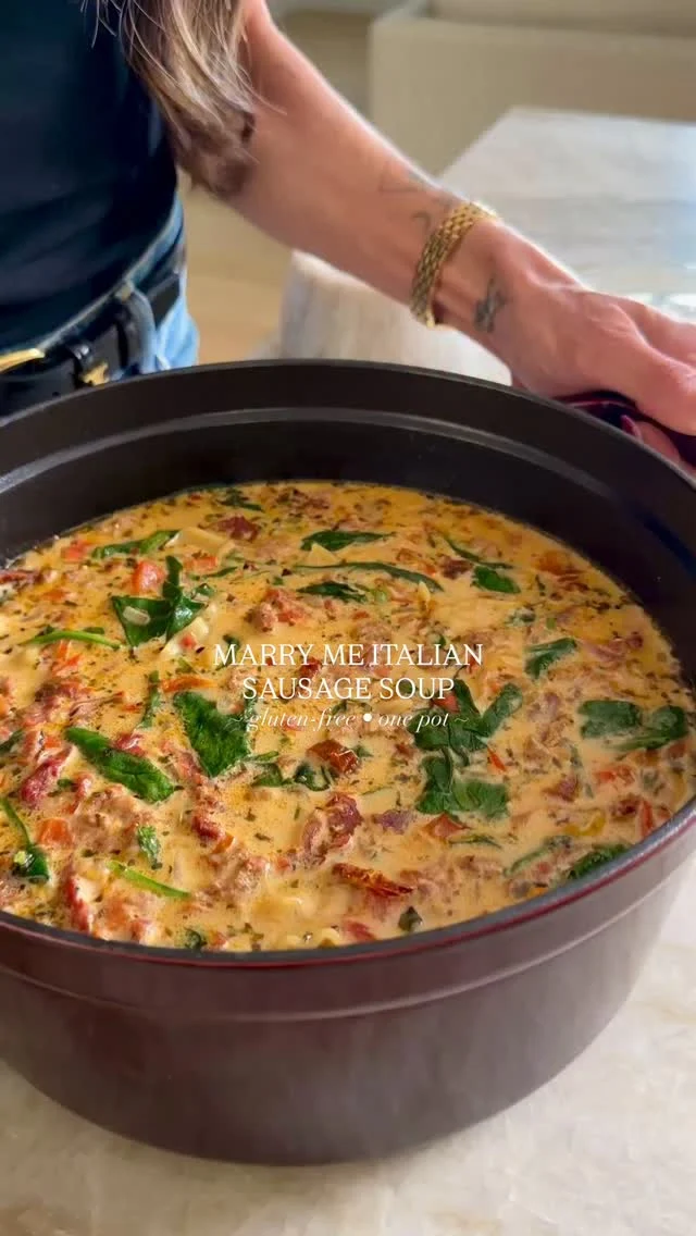 @kalejunkie 💍 MARRY ME ITALIAN SAUSAGE SOUP for Valentine’s Day and anytime that cozy soup craving hits—THIS is a winner 🏆 and I can’t wait to see your remakes! You can use any pasta shape you want and because the pasta cooks in the soup, it’s a low effort, easy clean up meal that might just land you a marriage proposal—I guess there’s only one way to find out 😏!⁣
⁣
Makes 6 servings ⁣
1/2 cup sundried tomatoes, in oil⁣
1 lb mild or spicy Italian sausage ⁣
1/2 white onion, finely diced⁣
1 red bell pepper, diced⁣
3 cloves garlic, minced ⁣
6 cups chicken broth⁣
2 tsp Italian seasoning⁣
1 tsp crushed red pepper flakes⁣
1 tsp kosher salt⁣
3/4 cup dried pasta of choice (I’m using gluten-free pasta)⁣
3/4 cup heavy cream or coconut milk⁣
3 cups spinach⁣
1/3 cup fresh basil, chopped ⁣
3/4 cup parmesan cheese, freshly grated⁣
⁣
First, slice the sundried tomatoes into pieces and set aside. Chop the onion, bell pepper, and mince your onion. Use 2 tb of the oil from the sundried tomato jar and add it to a large pot over medium heat. Once the pot is hot, add the sausage. Mash into smaller pieces and once almost cooked through, add the onion, pepper, and garlic. Stir for 4-5 minutes until the veggies have softened then add in the chicken broth, sun-dried tomatoes, italian seasoning, red pepper flakes, and salt. Stir and bring to a gentle simmer then add in the pasta and let cook for 4-5 minutes, stirring, then reduce heat to low and add the heavy cream, spinach, and basil, stirring until fully incorporated and the spinach has wilted. Let cook for 3-4 more minutes or until the pasta is al dente. Remove from heat and stir in the parmesan cheese. Divide into bowls and serve with more parmesan cheese on top. Enjoy!⁣

Using: @shamrockfarmsmilk cream @parmigianoreggiano.na parm @staub_usa pot @thegiadzy gluten-free taccole corte pasta @mezzetta sundried tomatoes
⁣
Soup recipes | marry me chicken | valentines day recipes | budget friendly recipes | one pot meals | quick dinners