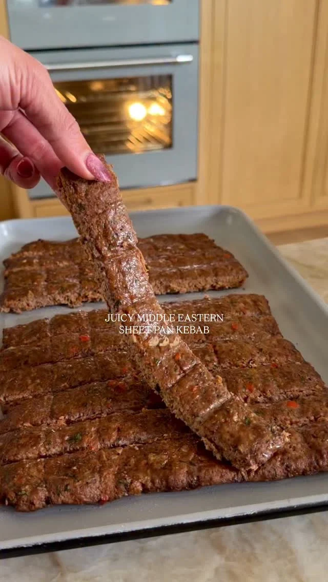 @kalejunkie JUICY SHEET PAN MIDDLE EASTERN BEEF KEBABS, seasoned just like my dad used to make when I was growing up! These kebabs are so juicy and flavorful, you will be obsessed! You can serve however you like—in lavash, pita, over rice, etc. I’m sharing my favorite way below—wrapped in warm lavash. And trust me, you MUST MAKE THESE!!! You’ll probably never make kebab another way again! 😏 ⁣
⁣
Be sure SAVE this post, SHARE with friends, and FOLLOW me @kalejunkie for more easy recipes like this!⁣
⁣
Makes 6-8 servings⁣
2 lbs ground beef (I like 85/15 for juicer kebabs, but leaner works too!)⁣
1/2 white onion⁣
1 red bell pepper⁣
4 cloves garlic⁣
1/4 cup parsley, chopped⁣
2 tb tomato paste⁣
2 tsp cumin⁣
2 tsp paprika⁣
2 tsp aleppo pepper (optional but recommend)⁣
1 tsp ground black pepper ⁣
1 1/2 tsp kosher salt⁣
⁣
Salad⁣
2 persian cucumbers, chopped⁣
1/2 red onion, sliced⁣
2 roma tomatoes, chopped⁣
2 tb sumac⁣
2 tb red wine vinegar⁣
2 tb avocado oil⁣
1 tsp kosher salt⁣
⁣
Yogurt sauce⁣
1 cup greek yogurt⁣
1 Persian cucumber, grated, liquid pressed out⁣
1/2 lemon⁣
1/2 tsp kosher salt⁣
⁣
Lavash⁣
⁣
Preheat oven to 375F. First, make the kebabs. In a small food processor, blend the onion, bell pepper and garlic. It will be liquidy. Transfer to a bowl and use a paper towel to remove as much moisture as possible. Next, add the beef to a large bowl along with the onion/bell pepper/garlic mixture, parsley, and seasonings. Mix very well until incorporated—I like to use my hands. Spread the beef mixture evenly in a flat layer on a greased quarter sheet pan. Make cuts horizontally and vertically just like kebabs you see at a restaurant! Bake for 20 minutes, then broil for an additional 4-5 minutes until golden on top. Remove from oven, cut beef along the horizontal lines you previously cut, to separate the kebabs. To make the salad, chop the veggies and toss with the vinegar, avocado oil, sumac and salt. Make the yogurt sauce and serve as desired. On a lavash, spread yogurt mixture, add the 2-3 kebabs, and the salad and fold up. Enjoy!