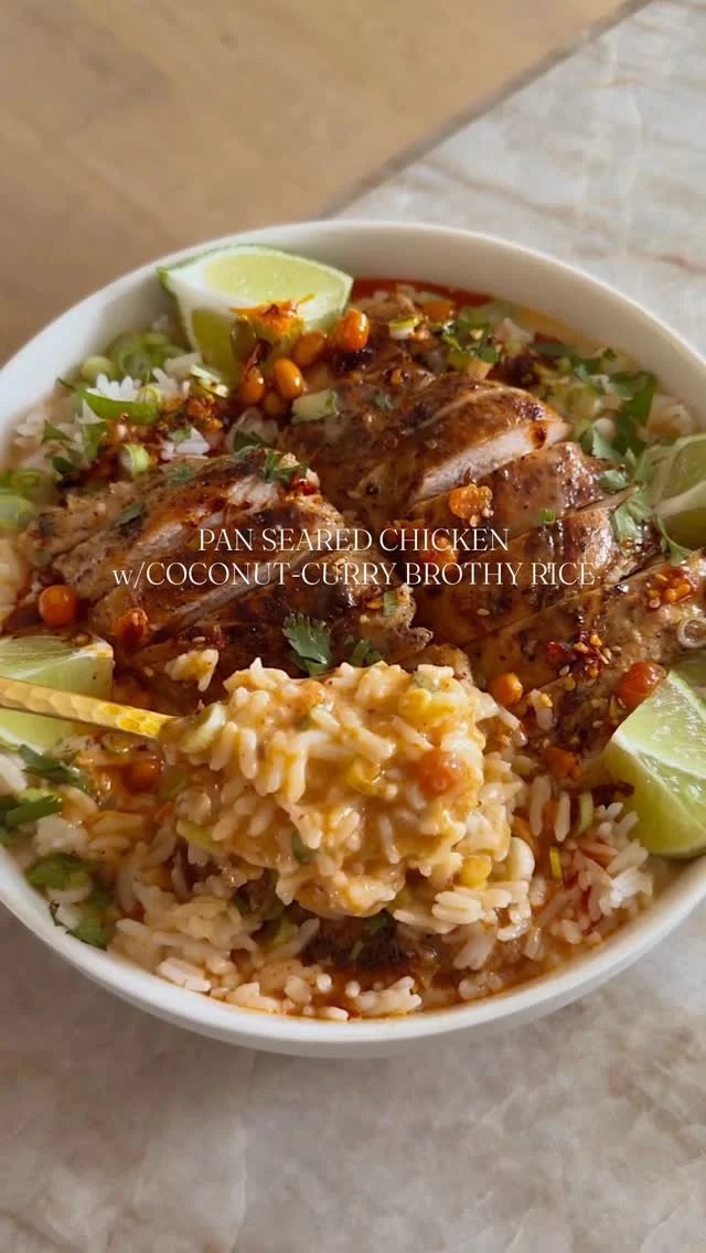 @kalejunkie ✨ PAN SEARED CHICKEN W/COCONUT CURRY BROTHY RICE aka my latest hyper fixation meal and it is easy to make! You simply pan sear chicken thighs and then make the most flavorful coconut curry broth that gets poured directly over warm rice, for the ultimate comfort food experience. All I have to say is that you must—MUST—make this and report back because it is amazing. ⁣
⁣
SAVE this post, SHARE with friends, and FOLLOW me @kalejunkie for more!!⁣
⁣
Makes 4 servings⁣
For the chicken:⁣
2 tsp avocado oil⁣
4 boneless, skinless chicken thighs⁣
Salt & pepper⁣
1/4 cup chicken broth⁣
⁣
For the broth:⁣
2 tsp avocado oil⁣
2 tsp ginger, grated or ginger paste⁣
3 cloves garlic, minced⁣
2-3 tb red curry paste (depending on your spice preference)⁣
1 tb Better than Bouillon ⁣
3/4 cup chicken broth⁣
1 14 oz can full fat coconut milk⁣
1 tsp fish sauce⁣
1 lime, juiced⁣
⁣
2 cups cooked jasmine rice (to save time, I buy frozen and then microwave it!)⁣
2 green onions, sliced⁣
2 tb cilantro, chopped, for garnish⁣
2 tsp chili oil for garish (optional) - I used @flybyjing which has peanuts in it :)⁣
Additional lime wedges⁣
⁣
Pat chicken dry with paper towels and season with salt and pepper. Heat oil in a large skillet over medium heat. Add chicken thighs to the skillet. Cook for 5-7 minutes without moving (VERY IMPORTANT), and then flip only when the chicken easily releases on its own. Cook for 7-10 minutes more. Pour in the chicken broth to deglaze the bottom and sides of pan with the crispy browned bits until they’re no longer sticking to the pan. Remove from heat and let chicken cool on a cutting board before slicing. Next, make the sauce. In a saucepan over medium heat, add the avocado oil. Once hot, add the ginger and garlic, stirring for one minute, then adding in the curry, bouillon and broth. Stir for another 2 minutes then add in the coconut milk, fish sauce and lime. Cover, reduce heat to low and let simmer for 5 minutes. Make rice your preferred way. Assemble your bowls with rice on the bottom, 1 sliced chicken breast, and a generous pour of the broth on top. Garnish with green onions, cilantro and chili oil. Serve with lime wedges. ENJOY!⁣
#brothyrice