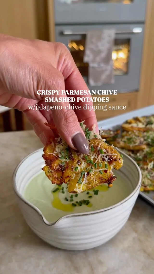 @kalejunkie ✨ CRISPY PARMESAN CHIVE SMASHED POTATOES WITH JALAPENO CHIVE DIPPING SAUCE! I will go on the record and say that if you make this, make a double batch because you will eat the first all by yourself! They potatoes come out perfectly crispy and the sauce takes them to the next level. These are perfect for Easter or anytime you need a change from boring potatoes!⁣
⁣
SAVE this post, SHARE with friends and FOLLOW me @kalejunkie for more easy recipes!⁣
⁣
Makes 4 to 6 servings⁣
⁣
POTATOES ⁣
1 lb baby potatoes, the smaller the better⁣
2 tb olive oil⁣
1 bunch chives, finely chopped⁣
1 1/4 cups shredded parmesan cheese⁣
1 tsp kosher salt⁣
1 tsp ground black pepper⁣
1 tsp crushed red pepper flakes⁣
1 tsp garlic powder⁣
⁣
JALAPENO CHIVE SAUCE⁣
1 cup greek yogurt⁣
1 bunch chives, roughly chopped⁣
1/2 jalapeño, roughly chopped and seeds removed⁣
2 cloves garlic⁣
1 tb olive oil⁣
1 lemon, juiced⁣
1/2 tsp kosher salt⁣
⁣
Bring a large pot of salted water to a boil. Once boiling, drop in the potatoes. Boil until fork tender, ~20 minutes. Pour the potatoes into a colander, rinse with cold water and set aside to cool. Preheat oven to 400F. Drizzle two baking sheets with the olive oil (or work in batches using one baking sheet). Add half of the potatoes to the baking sheet/s. Toss them in the olive oil. Now, using the palm of your hand, smash each one down (it will be messy). You can use a cup, but hand works best! Drizzle the top with more olive oil, and sprinkle on the salt, pepper, red pepper flakes and garlic powder. Bake for 25 to 30 minutes, flipping the potatoes once, until the skins have become nicely browned. Remove from the oven. Sprinkle the potatoes with the cheese and roast for another 2-3 minutes, just until the cheese melts. Last, sprinkle the potatoes with the chives and flaky salt. Serve alone or with the jalapeno chive dipping sauce. To make the dipping sauce, add all of the ingredients to a small blender and blend until smooth. Taste and adjust seasonings as needed and enjoy!