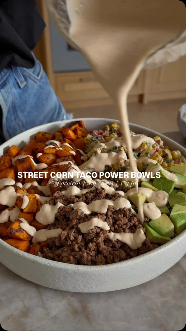@kalejunkie STREET CORN BEEF POWER BOWLS, because it’s time to elevate those cottage cheese beef bowls that went viral last year :) This bowl is giving taco vibes thanks to the taco-seasoned beef, and it’s paired with roasted sweet potatoes for those good carbs and topped with my smoky street corn salad. Yes this is a need, not a want!⁣
⁣
FOLLOW me @kalejunkie for more easy, healthy recipes and be sure to SAVE this post!⁣
⁣
Makes 4 servings⁣
1 lb lean ground beef⁣
2 tb taco seasoning⁣
2 sweet potatoes, peeled and cubed⁣
1 tsp olive oil⁣
1 tsp smoked paprika⁣
1 tsp kosher salt⁣
1 avocado, diced⁣
⁣
Corn Salad ⁣
3 cups frozen corn⁣
1 red bell pepper, finely diced⁣
1/2 red onion, finely diced⁣
1 jalapeno, seeds removed, finely diced⁣
1/3 cup cilantro, finely chopped⁣
⁣
Smoky Street Corn Dressing⁣
1 cup fat free greek yogurt ⁣
1/2 cup cottage cheese⁣
1 lime, juiced⁣
2 cloves garlic⁣
1 tsp onion powder ⁣
1/2 tsp chili powder⁣
1/2 tsp smoked paprika⁣
1/2 tsp black pepper⁣
1/2 tsp salt⁣
Water to thin, if needed⁣
⁣
Preheat oven to 400F. Add sweet potatoes to a baking sheet. Toss with olive oil, paprika and salt. Bake for 20 minutes, then toss, then bake again for 10-15 minutes more until golden and crunchy. Remove tray from oven and set aside. Now make the beef. Spray a large non-stick skillet with cooking spray (or lightly oil the pan). Once hot, add the ground beef and taco seasoning, breaking it up with a meat masher into tiny pieces until cooked through. If it’s dry, add 2-3 tb water. Set aside. For the corn salad, add the salad ingredients to a large bowl, then make your dressing. Add all of the dressing ingredients to a small blender and blend until smooth. Taste and adjust seasonings as desired. Pour 3/4 of the dressing over the salad and toss to coat well. Last, assemble your bowls—divide the sweet potatoes, ground beef, avocado, and corn salad between bowls and drizzle with remaining dressing on top. Enjoy! #streetcorn #viralrecipes #tacosalad #powerbowls