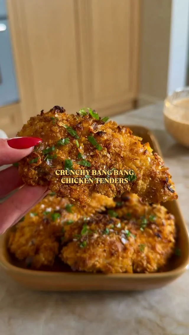 @kalejunkie CRUNCHY BANG BANG CHICKEN TENDERS. I hate saying “you guys,” but YOU GUYS 😱🤗. If there’s one recipe you make of mine—let it be these. These chicken tenders are anything but basic—coated in seasoned corn flakes and air fried (or oven baked) and then dipped in my famous no-mayo Bang Bang sauce that might just change your life. It’s insanely delicious! ⁣
⁣
Comment LINKS for everything I used in this video and be sure to FOLLOW me @kalejunkie so you don’t miss recipes like this! ⁣
⁣
Makes 4 to 6 servings⁣
⁣
BANG BANG SAUCE⁣
1 cup greek yogurt (or cottage cheese)⁣
1/4 cup sriracha⁣
2 tb rice vinegar ⁣
1/4 cup low sodium soy sauce⁣
2 tb maple syrup or honey⁣
1 tsp fresh grated ginger ⁣
1/2 tsp crushed red pepper flakes⁣
⁣
CRISPY CHICKEN TENDERS⁣
2 lbs chicken tenders⁣
3 1/2 cups corn flakes, crushed into tiny pieces⁣
2 tsp garlic powder⁣
2 tsp smoked paprika ⁣
1 tsp kosher salt⁣
1 tsp ground black pepper⁣
2 eggs, whisked ⁣
1/2 cup all purpose flour, oat flour or gf flour⁣
Avocado oil spray ⁣
⁣
First, prepare your Bang Bang sauce. Add of the ingredients to a blender and blend until smooth. Taste and adjust seasonings and set aside. Next, make the chicken. If using oven, preheat your oven to 425F. If using air fryer, nothing to do yet. Pat chicken tenders dry. In one bowl, add the crushed corn flakes and seasonings. Mix together well. In another bowl, whisk together the eggs well and set aside. In a third bowl, add the flour. Now, dredge each piece of chicken into the flour, coating well, then into the egg, then into the corn flake mixture, pressing the mixture onto the chicken and getting those seasonings from the bottom of the bowl. Line them up on a large baking sheet or the air fryer basket. You may need to work in batches. Spray the tops with avocado oil spray so they don’t burn. Bake for 20-22 minutes. For air fryer, air fry at 400F for 6 minutes then flip to the other side, spray again, and air fry for 6 minutes more. The internal temperature should be 165F. Dip into the bang bang sauce and enjoy! #chickenrecipes #chickentenders #bangbangchicken⁣
⁣
⁣