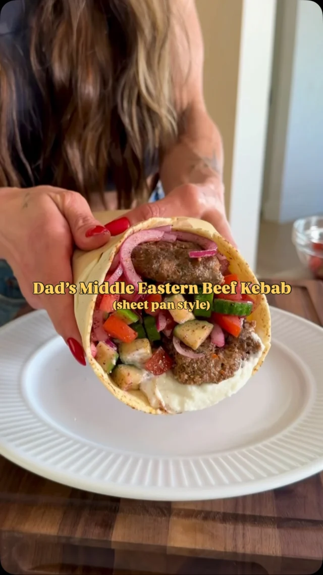 @kalejunkie DAD’S MIDDLE EASTERN BEEF KEBABS, sheet pan style! These kebabs are so juicy and flavorful, you will be obsessed! You can serve however you like—in lavash, pita, over rice, etc. I’m sharing my favorite way below—wrapped in a warm pita. And trust me, you MUST MAKE THESE!!! You’ll probably never make kebab another way again! 😏 ⁣
⁣
Be sure SAVE this post, SHARE with friends, and FOLLOW me @kalejunkie for more easy recipes like this!⁣
⁣
Makes 6-8 servings⁣
2 lbs ground beef (I like 85/15 for juicer kebabs, but leaner works too!)⁣
1/2 white onion⁣
1 red bell pepper⁣
4 cloves garlic⁣
1/4 cup parsley, chopped⁣
2 tb tomato paste⁣
2 tsp cumin⁣
2 tsp paprika⁣
2 tsp aleppo pepper (optional but recommend)⁣
1 tsp ground black pepper ⁣
1 1/2 tsp kosher salt⁣
⁣
Salad⁣
2 persian cucumbers, chopped⁣
1/2 red onion, sliced⁣
2 roma tomatoes, chopped⁣
2 tb sumac⁣
2 tb red wine vinegar⁣
2 tb avocado oil⁣
1 tsp kosher salt⁣

Yogurt sauce or toum
Pita or lavash
⁣
Preheat oven to 375F. First, make the kebabs. In a small food processor, blend the onion, bell pepper and garlic. It will be liquidy. Transfer to a bowl and use a paper towel to remove as much moisture as possible. Next, add the beef to a large bowl along with the onion/bell pepper/garlic mixture, parsley, and seasonings. Mix very well until incorporated—I like to use my hands. Spread the beef mixture evenly in a flat layer on a greased quarter sheet pan. Make cuts horizontally and vertically just like kebabs you see at a restaurant! Bake for 20 minutes, then broil for an additional 4-5 minutes until golden on top. Remove from oven. It will shrink up and be juicy in the pan, I like to pour it out. Cut beef along the horizontal lines you previously cut, to separate the kebabs. To make the salad, chop the veggies and toss with the vinegar, avocado oil, sumac and salt. Serve as desired and enjoy! #viralrecipes #viralkebab #sheetpankebab⁣