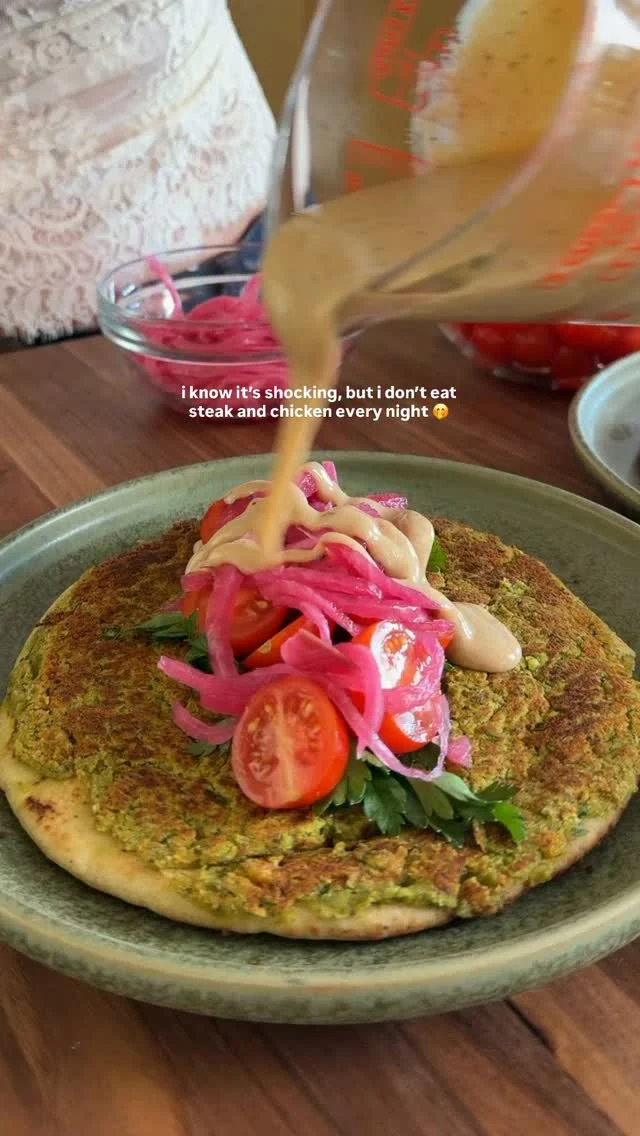 @kalejunkie FALAFEL SMASH TACOS with lemon tahini sauce! This is my fav way to enjoy falafel, no deep frying required. You can load them up with whatever you’d like—I added my lemon tahini sauce, picked onions, tomatoes and parsley, but use what you have in your fridge. Hope you love this and be sure to tag me in your creations!⁣
⁣
Makes 6 servings (1 loaded taco each)⁣
Falafel⁣
2 cans garbanzo beans, drained and rinsed ⁣
1 yellow onion, roughly chopped ⁣
3 cloves garlic⁣
1 cup Italian parsley, roughly chopped⁣
3/4 cup cilantro, roughly chopped⁣
1 1/2 tsp cumin⁣
1 tsp chili powder⁣
1 tsp coriander⁣
1/2 tsp cinnamon ⁣
1 tsp baking powder⁣
1 tsp kosher salt⁣
⁣
Lemon Tahini Sauce⁣
¼ cup lemon juice⁣
⅓ cup olive oil⁣
3 tb tahini⁣
2 tb honey⁣
2 tb red wine vinegar⁣
1 tsp garlic powder⁣
1 tsp sea salt⁣
1 tsp black pepper⁣
Water to thin, as needed⁣
⁣
6 pita breads⁣
Baby tomatoes, parsley, pickled onions (optional), sesame seeds⁣
⁣
In a large food processor, add the onion, garlic, chickpeas. Process into fine crumbs, then add in the parsley, cilantro, spices, and baking powder. It should be a paste. You may need to scrape down the inside of the food processor a few times. Be patient, it will come together. Next, make the dressing. In a bowl, whisk together the ingredients listed above. Taste and set aside. Now, add a large spoonful of the falafel mixture to each pita, spreading evenly. I like mine thick and hearty :). Add 1 tsp avocado oil to a pan over medium heat. Once the pan is hot, place the pita falafel side down, cook until golden and crispy, about 3 minutes. Flip to the other side to crisp the bread, another minute or so. Repeat the process with remaining tacos. Add your toppings, lemon tahini sauce, then fold up and enjoy! #falafel #falafeltacos #smashtacos