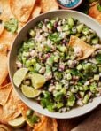 A bowl of the ultimate shrimp ceviche, along with a side of homemade tortilla chips