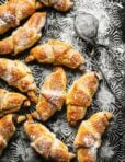 A bunch of the mini Nutella croissants, laid out on a countertop