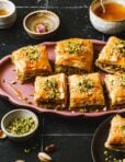 A plate of the pistachio walnut baklava, sitting on a countertop