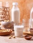 A glass of the salted caramel cashew milk, sitting on a countertop