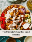 A bowl of crispy rice salad topped with cauliflower, tomatoes, cucumber slices, red onion, and drizzled with creamy dressing. A dollop of yogurt is on the side. Text reads, "The Ultimate Crispy Rice Salad Roundup.